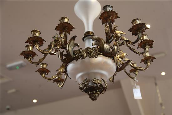 A 19th century French gilt metal and opaque glass twelve light chandelier, drop 3ft 1in. diameter 2ft 2in.